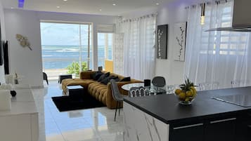 Deluxe Apartment | Living area | 190-cm Smart TV with digital channels