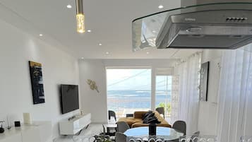 Deluxe Apartment | Living area | 190-cm Smart TV with digital channels