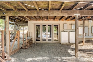 A construction site with a wooden structure, gravel floor, and visible electrical panels. - Spacious Chalet with Game Loft & Pool Access (Arnold)