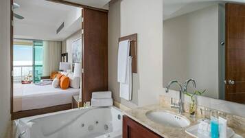 Bathtub, jetted tub, hair dryer, towels