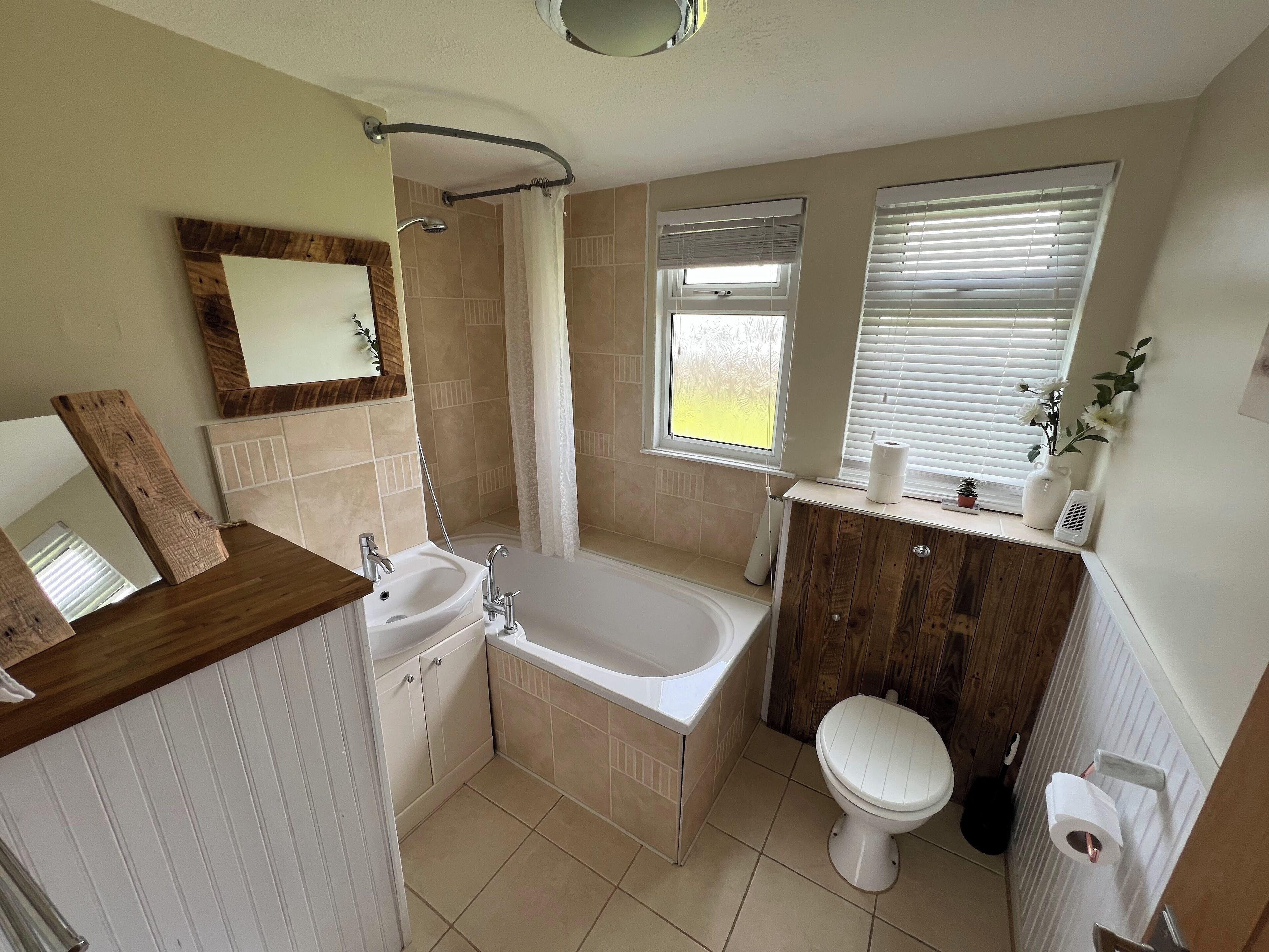 Combined shower/tub, hair dryer, towels, toilet paper