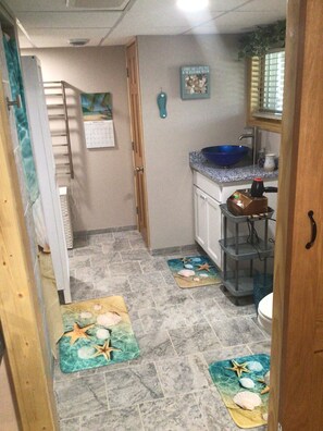 Shower, hair dryer, towels, shampoo