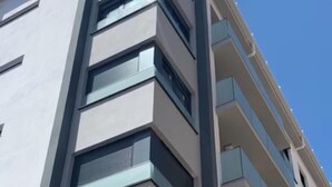 A modern multi-story building with a flat facade, large windows, and balconies. - SUITE MARINA BEACH COSTA DEL SOL (Fuengirola)