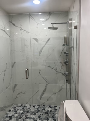 Bathtub, hair dryer, towels, soap