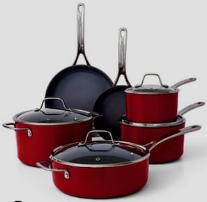 A collection of cookware including pots and pans in red and black colors.