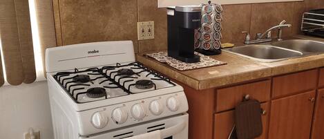 Fridge, microwave, stovetop, coffee/tea maker