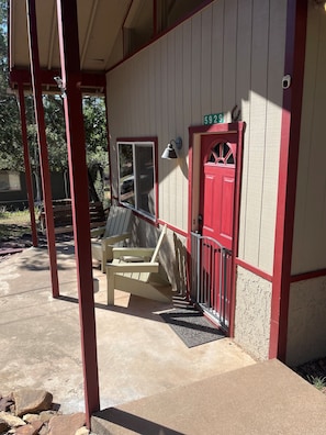 A building with a red door and a number "5929" above it.