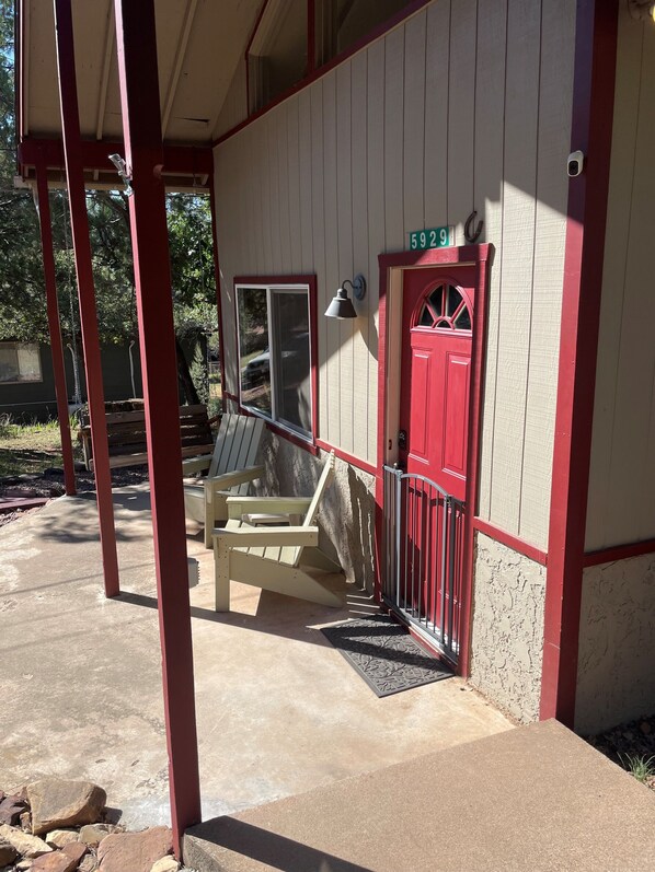 A building with a red door and a number "5929" above it.