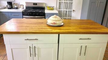 Fridge, microwave, coffee/tea maker, cookware/dishes/utensils