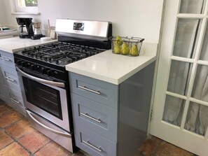 Fridge, microwave, coffee/tea maker, cookware/dishes/utensils