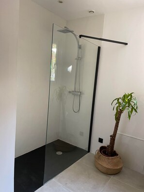 Bathtub, towels, soap, toilet paper
