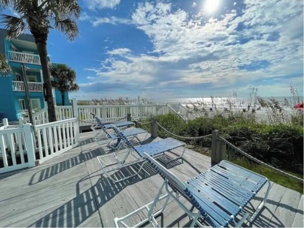 Stroll along the boardwalk to the beach, where lounge chairs await your relaxation.