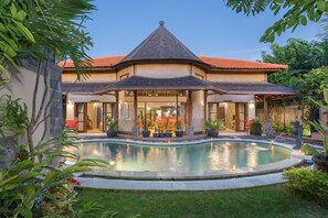 A large house with a swimming pool, surrounded by lush greenery. -  Villa SoDe Balangan by Nagisa Bali (Jimbaran)