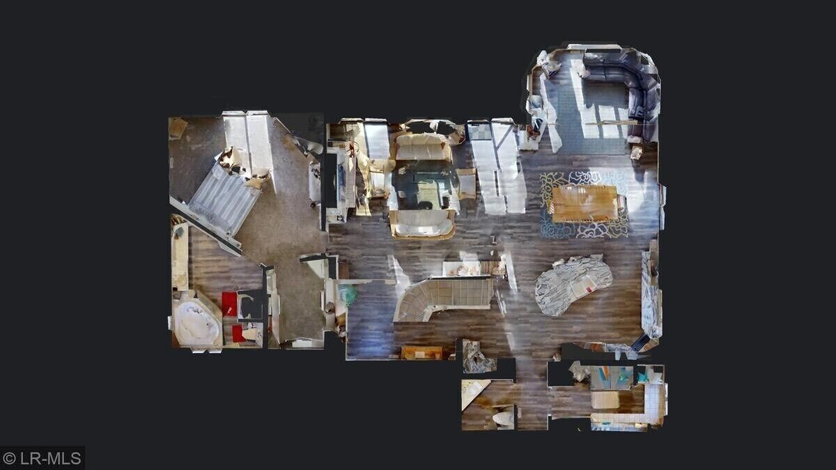 A floor plan of a hotel with multiple rooms, a kitchen area, and a dining space.