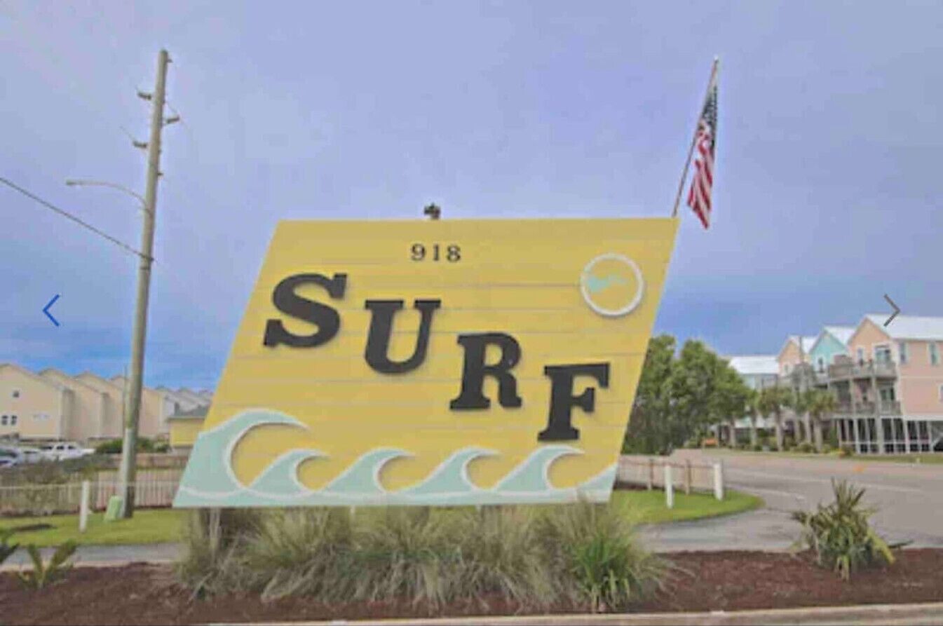 A yellow sign with the word "SURF" and a number "918" on it.