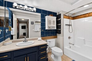 Combined shower/tub, hair dryer, towels, soap