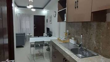 Apartment, 2 Bedrooms | Private kitchen | Fridge, stovetop