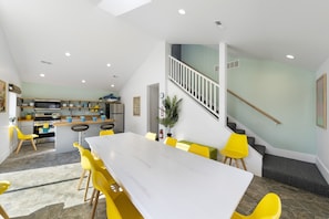 Enjoy meals in this spacious dining area with a large table and comfortable seating.