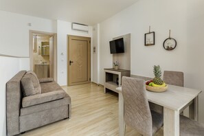 Economy Apartment | Living area | 40-inch Smart TV with satellite channels, TV - Aria Garden Suites (Sithonia)