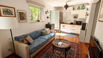 Apartment | Living area | 30-inch TV with digital channels
