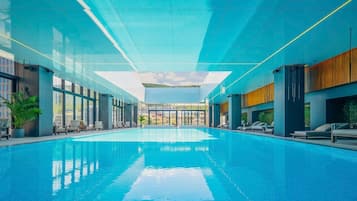 Indoor pool, pool umbrellas, sun loungers