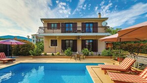 A two-story house with a swimming pool, outdoor furniture, and a garden. - Six Bedroom Villa with Pool (Kaštel Stari)