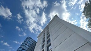 A modern building with a glass facade and a sign reading "THE PEOPLE". - The People Paris Marais (Paris)