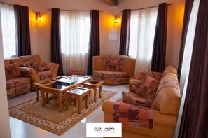 25-inch Smart TV with cable channels, TV - Stay.Plus Ole Den Party House Kajiado (Ngong)