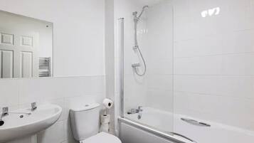 Bathtub, hair dryer, towels, soap
