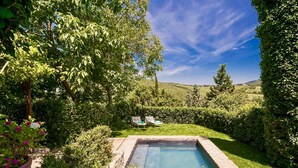 A rectangular swimming pool surrounded by lush greenery and a clear blue sky. - CASA VISTA - Four Bedroom Villa, Sleeps 8 (Gaiole in Chianti)