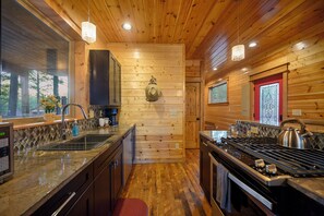 Fridge, microwave, oven, stovetop - Midnight Rhapsody-Romantic Cabin with Large Jacuzzi Tub & Outdoor Gas Fireplace (Broken Bow)