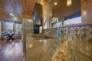 Fridge, microwave, oven, stovetop - Midnight Rhapsody-Romantic Cabin with Large Jacuzzi Tub & Outdoor Gas Fireplace (Broken Bow)