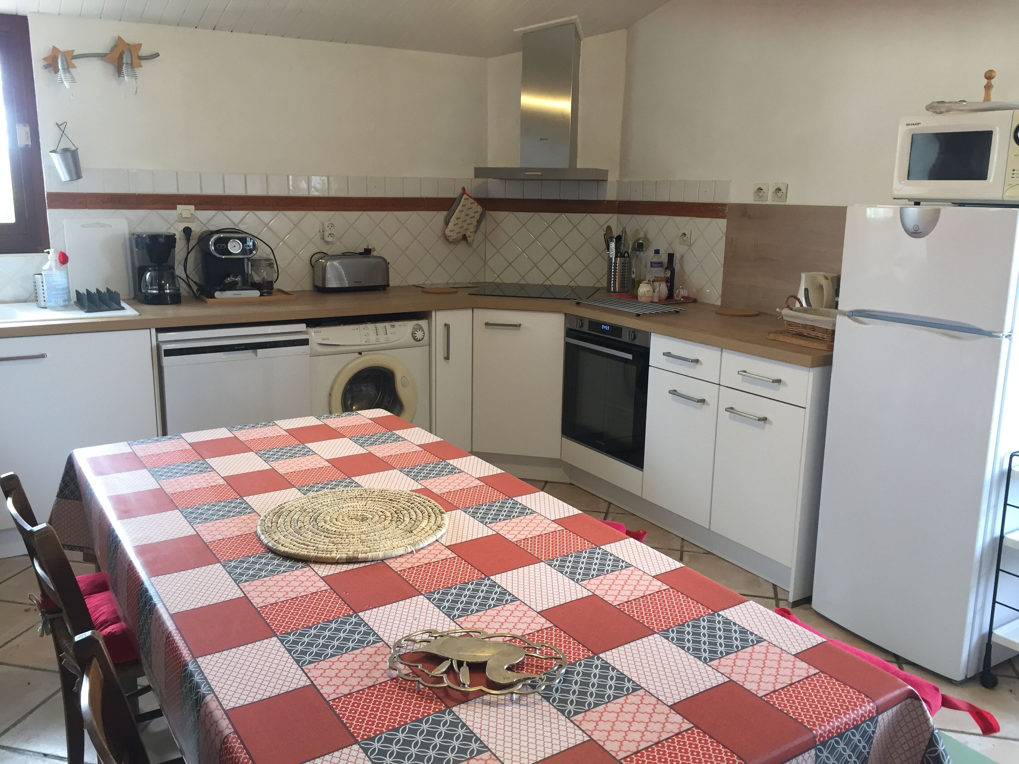 Typical country house, pink brick and Lauragais pebbles.
