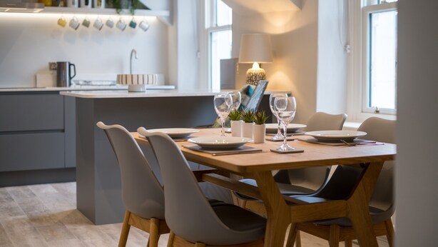A modern kitchen with a dining area. - Howe Keld 6 Second Floor (Keswick)