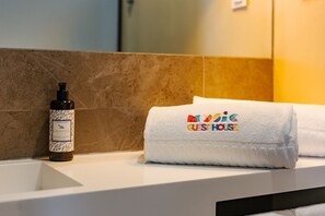 Shower, eco-friendly toiletries, hair dryer, towels