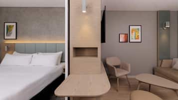 A modern hotel room with a bed, a desk, a chair, a sofa, and a TV mounted on the wall.