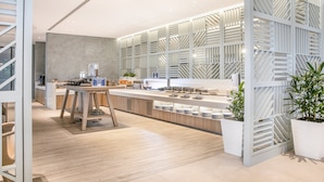 A modern kitchen with a central island, built-in appliances, and a contemporary design.