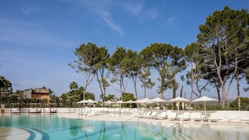 Indoor pool, pool umbrellas, pool loungers