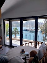 Panoramic Apartment, Sea View, Beachfront | Living area | 32-inch LCD TV with cable channels, TV
