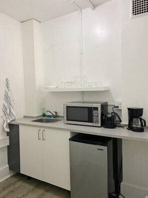 Microwave, stovetop, coffee/tea maker, electric kettle