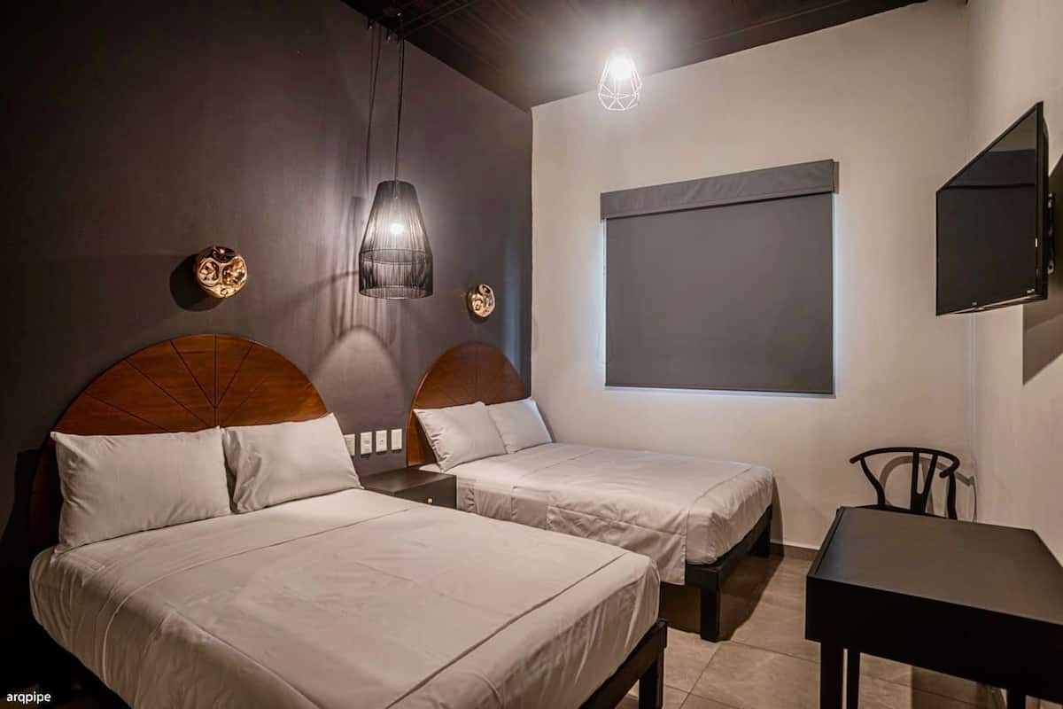 Habitación doble Deluxe | Escritorio, wifi gratis y ropa de cama
