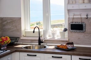 Design Apartment, 2 Bedrooms, Pool Access, Sea View | Private kitchen | Fridge, oven, stovetop, coffee/tea maker