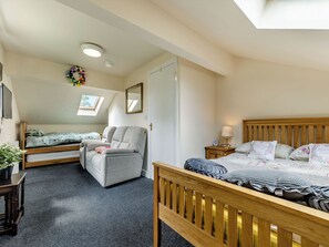 A bedroom with two beds, a desk, and a mirror. - Greystones Nawab Annex C (Flagg, Buxton)