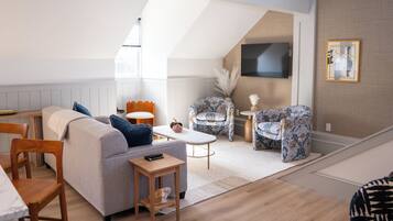 Superior Penthouse | Living area | 50-inch Smart TV with digital channels, Netflix, books