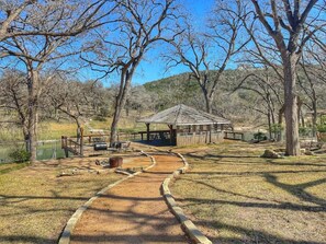 A park with a gazebo, pathways, and trees.