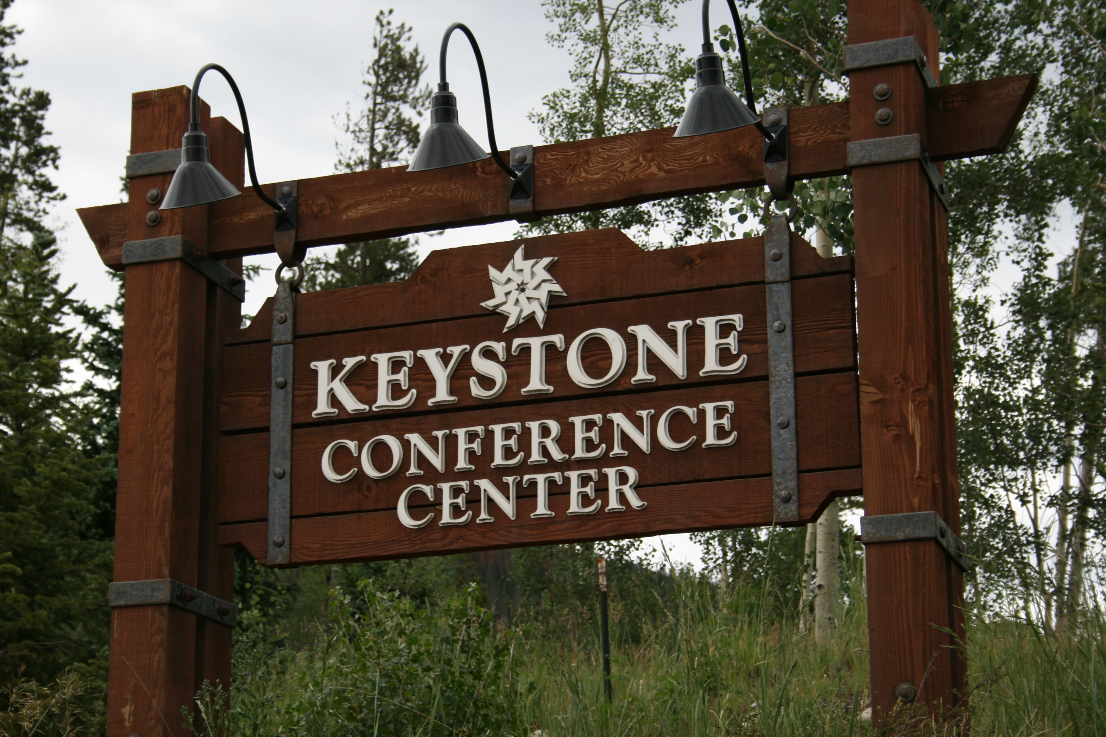 A wooden sign with the text 'Keystone Conference Center' and a star symbol above it.