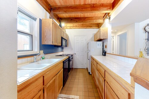 Two-story condo with a hot tub, WiFi, & wood-burning fireplace