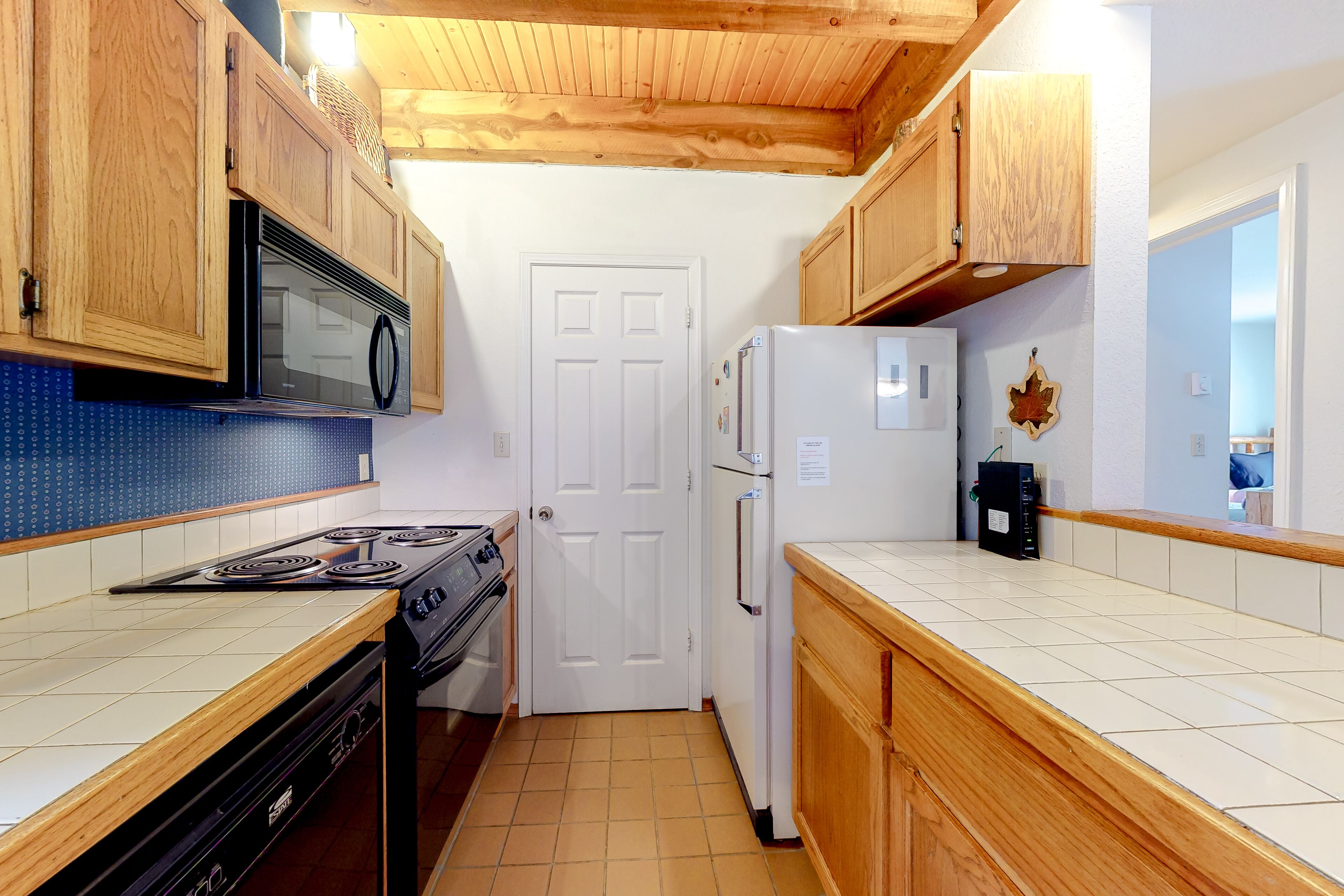 Two-story condo with a hot tub, WiFi, & wood-burning fireplace