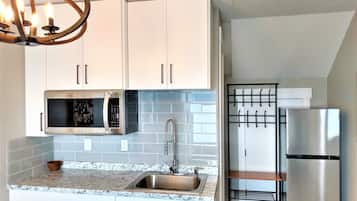 Fridge, microwave, stovetop, coffee/tea maker