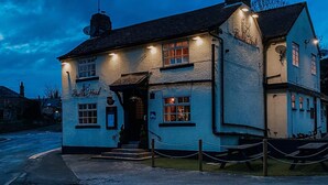 A traditional building with a sign reading "Bull's Head" and a pub sign above the entrance. - Bulls Head - Holymoorside (Chesterfield)